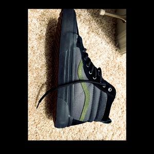 Army Green canvas and black leather sk8-hi vans